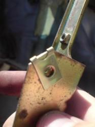 rover metro central locking motor brass clip lined up with holes on bracket