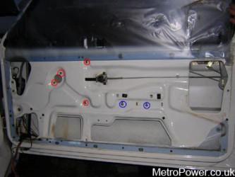 bolts to be removed in order to release the manual window winder mechanism